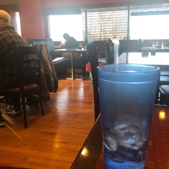 New Hibachi Buffet - My empty water with my waiter playing on his iPad. - Chinese Near Me - Stevens Point, Wisconsin