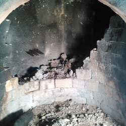 K.C. Wester - firebox before rebuild. This fireplace was not safe to use until we rebuilt it.