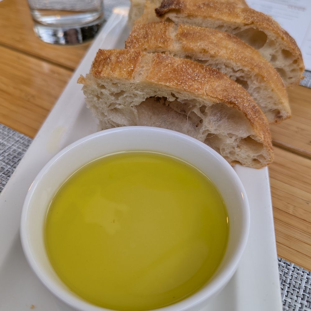 Novo Cucina - Ciabatta and olive oil. Bread service. Complimentary. - Pizza Near Me - Dunwoody, Georgia Novo Cucina - Ciabatta and olive oil. Bread service. Complimentary. - Pizza Near Me - Dunwoody, Georgia