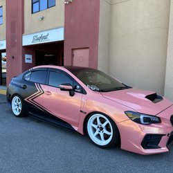 Blackout Window Tinting - Custom pink-and-black vehicle wrap completed on this Subaru WRX at Blackout Window Tinting in Gilroy.
