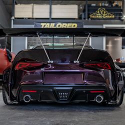 Tailored Garage Auto Restyling - Pandem wide body kit install paired with a full airlift kit and crimson blood vinyl wrap