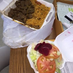 Pito's Restaurant - $9 plate. Beef stew with yellow rice & peas. Side salad