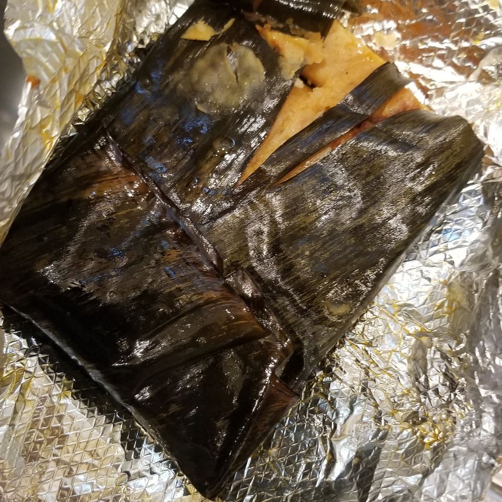 Tamales Irma - Banana leaf wrapped tamale, I cut part of it already. So moist and flavorful - highly recommend! 7/19/2020] - Mexican Near Me - Santa Ana, California