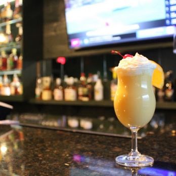 AJ's Diner & Bar - Signature Drink: Mango Velvet (Mango Lassi, Rum, Whipped Cream, Cherry) - Indian Near Me - Martinsburg, West Virginia AJ's Diner & Bar - Signature Drink: Mango Velvet (Mango Lassi, Rum, Whipped Cream, Cherry) - Indian Near Me - Martinsburg, West Virginia