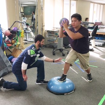 ATI Physical Therapy - Mike working with one of his athletes. - Physical Therapy Near Me - Renton, Washington ATI Physical Therapy - Mike working with one of his athletes. - Physical Therapy Near Me - Renton, Washington