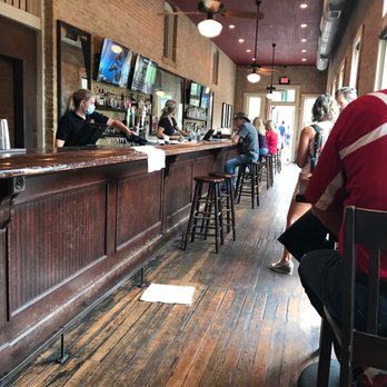 Mozie’s - a man sitting at a bar - American Near Me - New Braunfels, Texas Mozie’s - a man sitting at a bar - American Near Me - New Braunfels, Texas