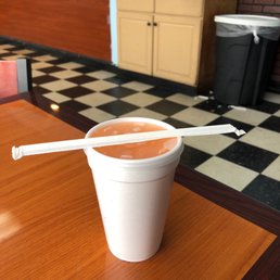 a cup of coffee and a pair of chopsticks
