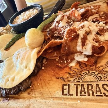 El Tarasco - Chilaquiles board with skirt steak, eggs, and beans. - Mexican Near Me - Sylmar, California