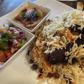 Majlis Restaurant - The lamb shank with my choice of side (hummus), comes with small salad. - Persian/Iranian Near Me - Pittsburg, California Majlis Restaurant - The lamb shank with my choice of side (hummus), comes with small salad. - Persian/Iranian Near Me - Pittsburg, California