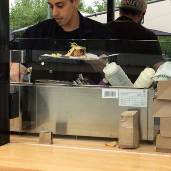 Taco Box - a man preparing food in a restaurant - Street Vendors Near Me - Montreal, Quebec Taco Box - a man preparing food in a restaurant - Street Vendors Near Me - Montreal, Quebec