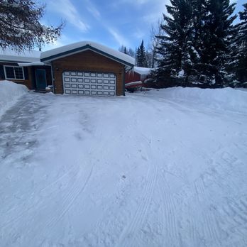 Caleb’s Services - a driveway covered in snow - Pet Waste Removal Near Me