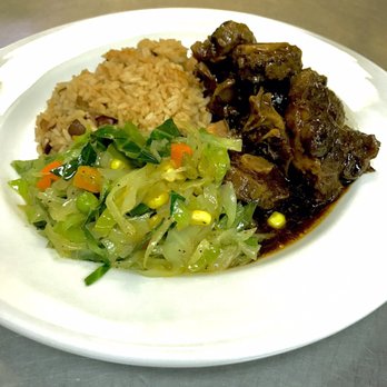 Hot Pot Under De Tree - This was life right here oxtail with rice and peas and stem veggies - Caribbean Near Me - New York, New York Hot Pot Under De Tree - This was life right here oxtail with rice and peas and stem veggies - Caribbean Near Me - New York, New York
