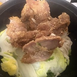 Fried pork chop with noodles and Napa cabbage. Fried pork chop with noodles and Napa cabbage.