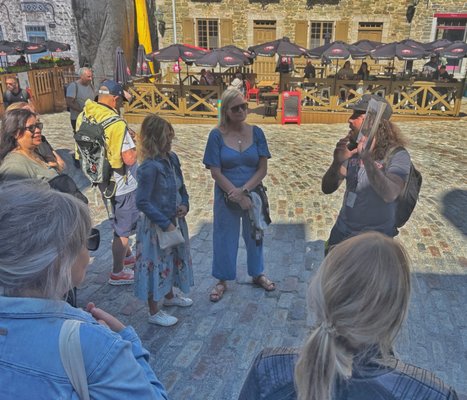 Photo of Samuel Dubois - Québec City, QC, CA. Sam showing a photo during the tour to help us connect to this place.