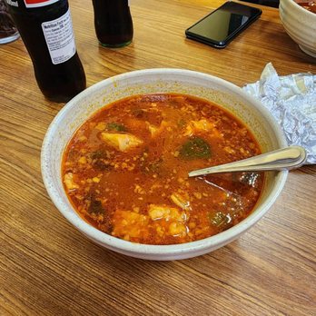 El Sobrino - a bowl of soup and a bottle of coke - Tacos Near Me - Downey, California