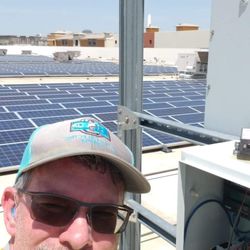 Blue Paw Energy Service - Jason Shaw on commercial roof solar PV performing O&M.