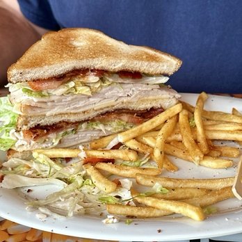 The Barn Bar And Grill - Turkey Club Sandwich with a side of fries. - Bars Near Me - Clayton, New York The Barn Bar And Grill - Turkey Club Sandwich with a side of fries. - Bars Near Me - Clayton, New York