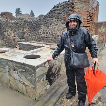 Dreaming Amalfi Coast - Dario in the rain at Pompeii - Tours Near Me - Positano, SA