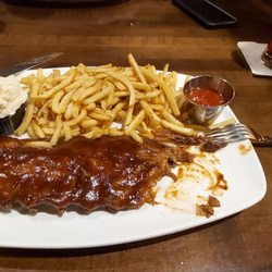 Bâton Rouge Steakhouse & Bar - Ribs. Mmm. Fries and coleslaw on the side