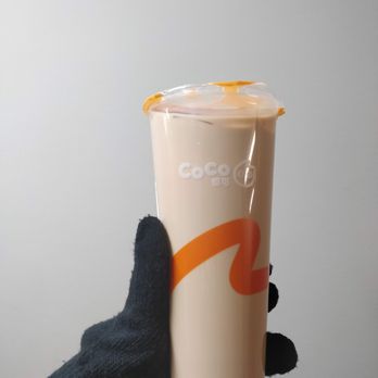 Coco Fresh Tea & Juice - a hand holding a coffee cup - Bubble Tea Near Me - Edmonton, Alberta