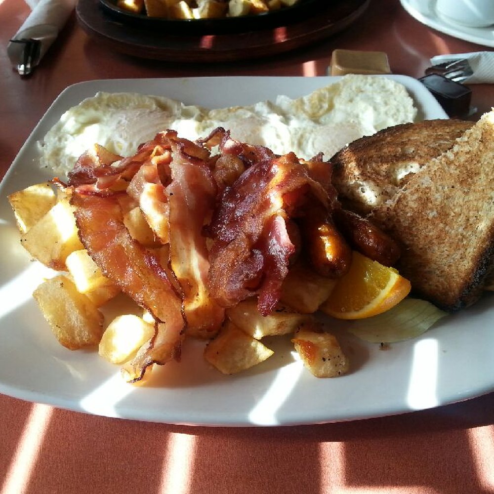 Fill your boots with whole wheat toast over easy eggs and bacon with hash browns