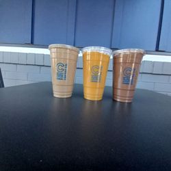 Canal Coffee - Item to the left and item to the right are below zero drinks. The one in the middle is a mango smoothie