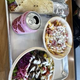 Chicken wrap and steak bowl with feta fries on the side Chicken wrap and steak bowl with feta fries on the side