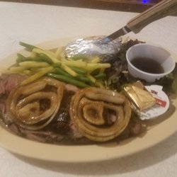 Traditions Pub - If mushrooms arent your thing ask for your prime with fried onions on it