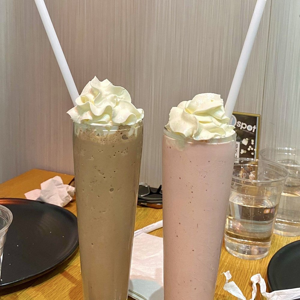 D Spot - two glasses of milkshakes on a table - Desserts Near Me - Mississauga, Ontario D Spot - two glasses of milkshakes on a table - Desserts Near Me - Mississauga, Ontario