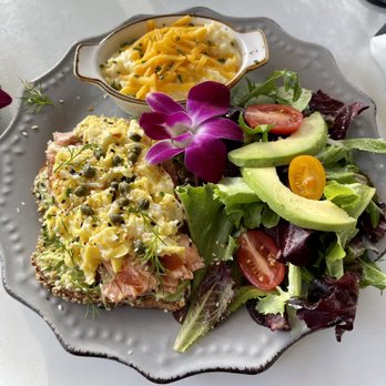 Harvest Kitchen & Bakery - Smoked salmon avocado toast with egg and grits - Breakfast & Brunch Near Me - Katy, Texas Harvest Kitchen & Bakery - Smoked salmon avocado toast with egg and grits - Breakfast & Brunch Near Me - Katy, Texas