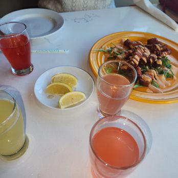 JAM Eateries - Mimosa flight. Pineapple, watermelon, grapefruit, and something that tasted like a Mai Tai. All delicious. Pork candy on the R. - Breakfast & Brunch Near Me - Ellicott City, Maryland