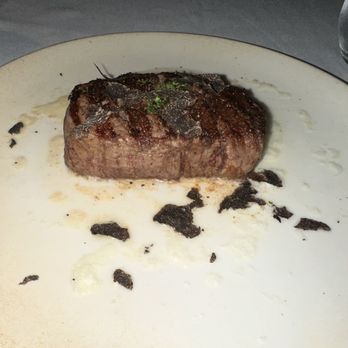 The Steak Library - 8 oz. Filet Mignon with garlic butter and fresh shaved truffles. Plate was sizzling hot! - Steakhouses Near Me - Lomita, California The Steak Library - 8 oz. Filet Mignon with garlic butter and fresh shaved truffles. Plate was sizzling hot! - Steakhouses Near Me - Lomita, California