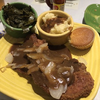Mama J's Kitchen - Fried pork chops smothered in gravy with onions, Mac n cheese and collards. - Soul Food Near Me - Richmond, Virginia