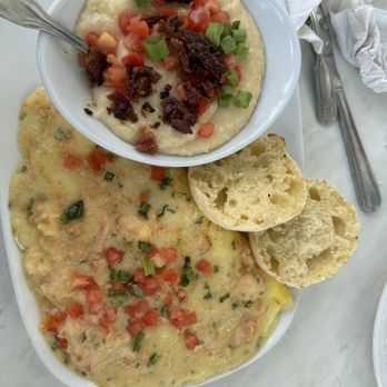 Another Broken Egg Cafe - Tasty breakfast possibly the Lobster & Brie Omelette, but I can't remember, with a side of city grits. - American Near Me - Orlando, Florida Another Broken Egg Cafe - Tasty breakfast possibly the Lobster & Brie Omelette, but I can't remember, with a side of city grits. - American Near Me - Orlando, Florida
