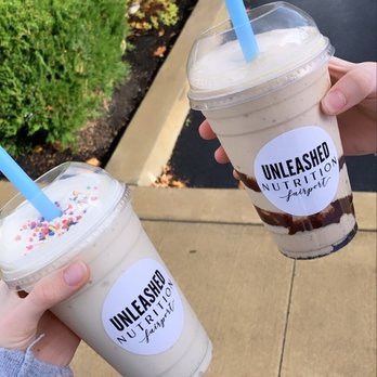 Unleashed Nutrition - Birthday cake shake on the left, Peanut Butter Ore-oh on the right - Juice Bars & Smoothies Near Me - Fairport, New York Unleashed Nutrition - Birthday cake shake on the left, Peanut Butter Ore-oh on the right - Juice Bars & Smoothies Near Me - Fairport, New York