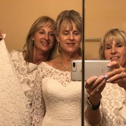 Selfie shot in the mirror of the bride and sisters... we loved our hair and make up.