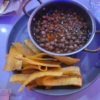 Romana European Tapas Lounge - Complimentary tostones chips with lentil - Tapas Bars Near Me - Newark, New Jersey
