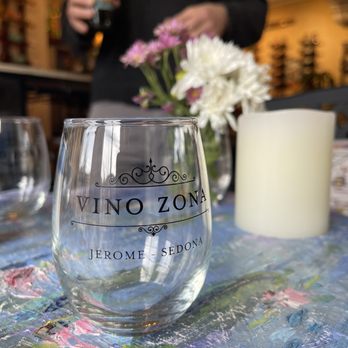 Vino Zona - a glass of wine on a table - Wine Tasting Room Near Me - Sedona, Arizona Vino Zona - a glass of wine on a table - Wine Tasting Room Near Me - Sedona, Arizona