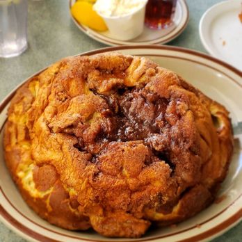 Peter's Cafe - Their famous cinnamon apple Dutch Baby Pancakes! Delicious! - American Near Me - Millbrae, California