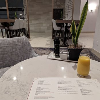 Bistro 40 - a glass of orange juice on a table - New American Near Me - Greensboro, North Carolina Bistro 40 - a glass of orange juice on a table - New American Near Me - Greensboro, North Carolina