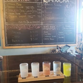 Superior Culture - a flight of alcohol glasses on a table - Kombucha Near Me - Marquette, Michigan