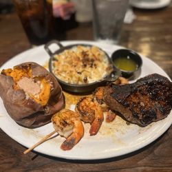 Spotted Cow Steakhouse - Steak, Mac and Cheese, Shrimp, and Baked Sweet Potato.
