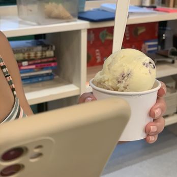 Fête - a woman holding a cup of ice cream - Coffee & Tea Near Me - Winnipeg, Manitoba Fête - a woman holding a cup of ice cream - Coffee & Tea Near Me - Winnipeg, Manitoba