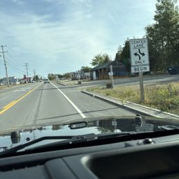 Drive through entrance.  Small sign beyond the Beginning Center Lane sign