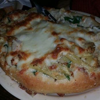 Firehouse Pizza & Pub - Penne alfredo served in a bread bowl shaped like a pizza. - Pizza Near Me - Normal, Illinois Firehouse Pizza & Pub - Penne alfredo served in a bread bowl shaped like a pizza. - Pizza Near Me - Normal, Illinois