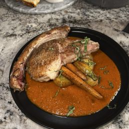 Pork chop with roast vegetables and fingerling potatoes