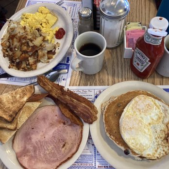 Crossroads Restaurant - Blueberry pancakes with eggs and meat and a two eggs breakfast with American fries and bacon. - Breakfast & Brunch Near Me - Bay City, Michigan