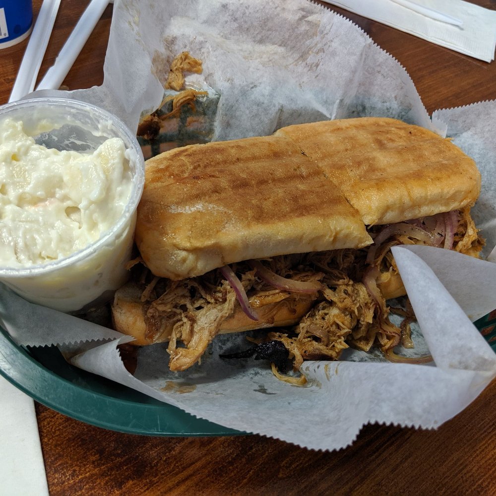 Village Corner Deli - Barbeque pork with extra onions and a side of potato salad. - Delis Near Me - Davenport, Iowa Village Corner Deli - Barbeque pork with extra onions and a side of potato salad. - Delis Near Me - Davenport, Iowa
