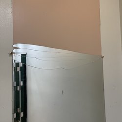 Crossgate Lanes - Broken mirror in the e men's room.