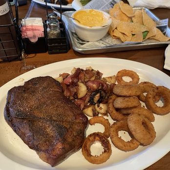 Nubby's Telegraph  - 1.5 lb Pork Steak, red potatoes, and onion rings - Barbeque Near Me - St. Louis, Missouri